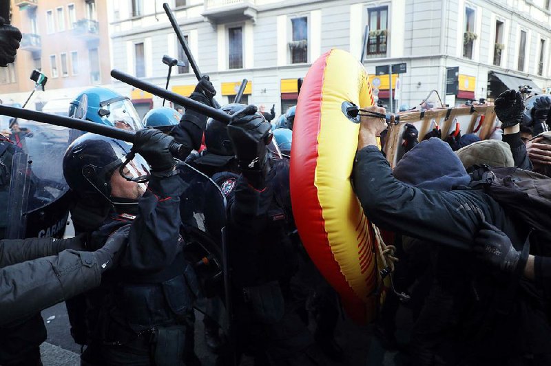 Police clash with students opposing a neo-fascist party during a rally Saturday in Milan, Italy. Similar marches were held in other Italian cities on the final weekend for political action before the March 4 national election. 