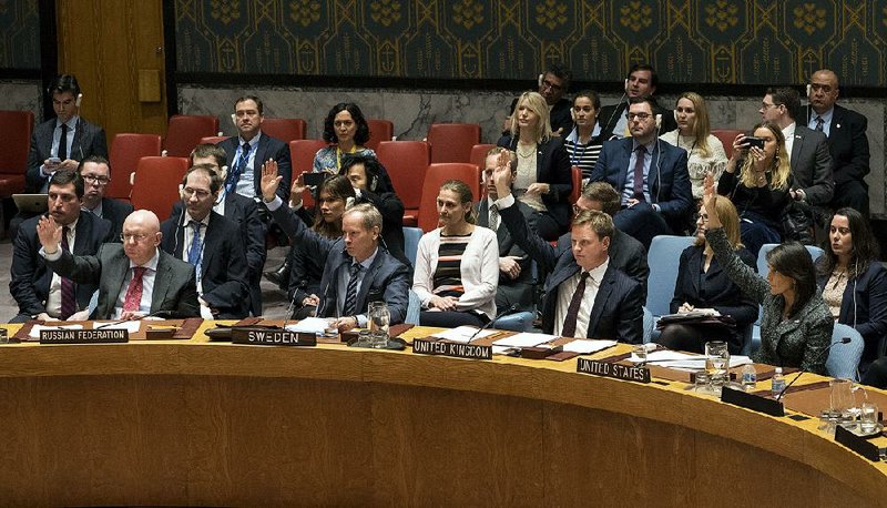 Security Council members vote Saturday at United Nations headquarters in New York on a resolution requesting a 30-day cease-fire in Syria. 