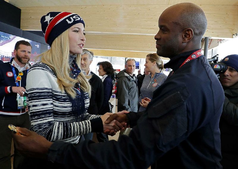 Ivanka Trump, a senior White House adviser, shakes hands with former U.S. bobsledder Garrett Hines on Saturday while visiting the U.S. Olympic headquarters in Pyeongchang, South Korea. 