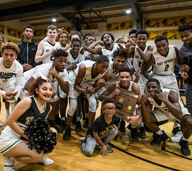 Special to The Sentinel-Record/Aaron Brewer 5A-SOUTH BOYS' CHAMPIONS: The Hot Springs senior high boys closed out a defensive struggle, 43-31, over Magnolia Friday at Trojan Fieldhouse to win the 5A-South conference championship.