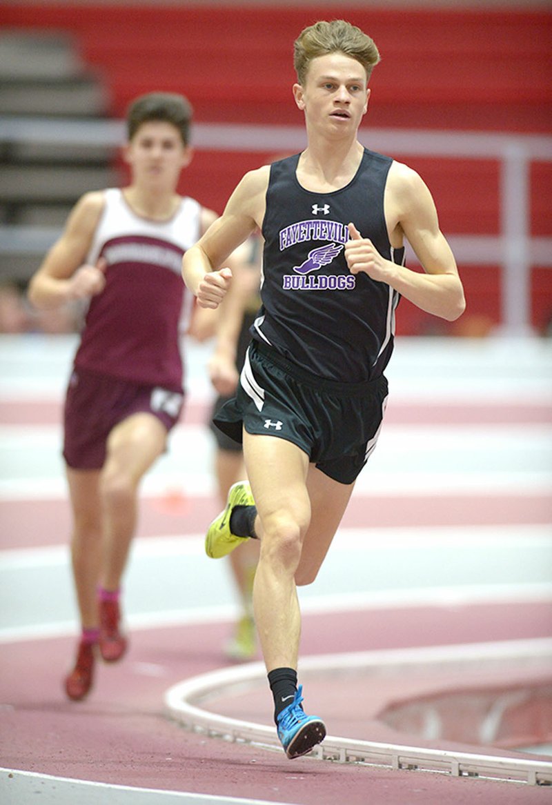 NWA Democrat-Gazette/ANDY SHUPE Camren Fischer of Fayetteville leads the field in the 1,600 meters Saturday during the State Indoor Track and Field Meet at the Randal Tyson Track Center in Fayetteville.