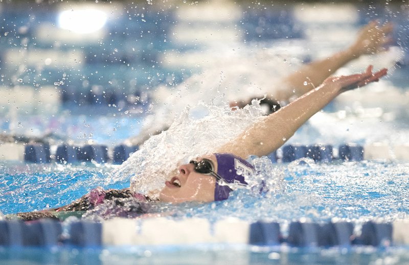 NWA Democrat-Gazette/CHARLIE KAIJO Fayetteville's Olivia Keith competes in the 200-yard individual medley Saturday during the Class 6A-7A state swimming and diving meet at the Bentonville Community Center in Bentonville.