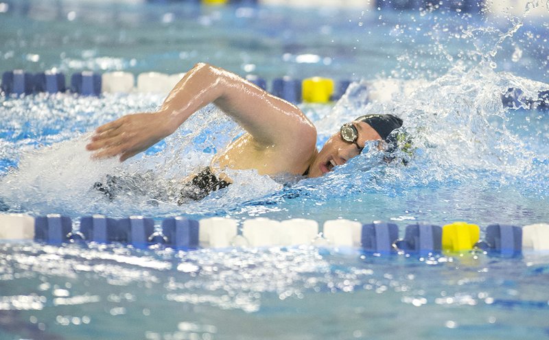 NWA Democrat-Gazette/BEN GOFF @NWABENGOFF Martina Thomas of Haas Hall swims to victory in the 200-yard freestyle Saturday during the Class 1A-5A State Swimming Championships at the Bentonville Community Center.