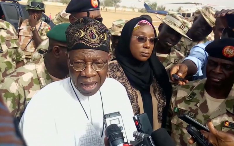 In this image taken from video, Lai Muhammed, Nigerian Minister of Information, speaks to the media in Dapchi, Yobe State, Nigeria, on Thursday Feb. 22, 2018. Parents in northern Nigeria say more than 100 girls are still missing three days after suspected Boko Haram extremists attacked their school. The announcement comes after government officials in Yobe state acknowledged that some 50 young women remained unaccounted for in the Monday evening attack. (AP Photo)