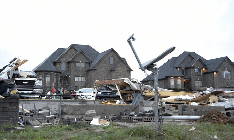 A home at the corner of Covey Rise Circle and Green Grove Way is reduced to rubble Sunday, Feb. 25, 2018, after a fierce storm came through the Farmington subdivision in Clarksville, Tenn. on Saturday night.
