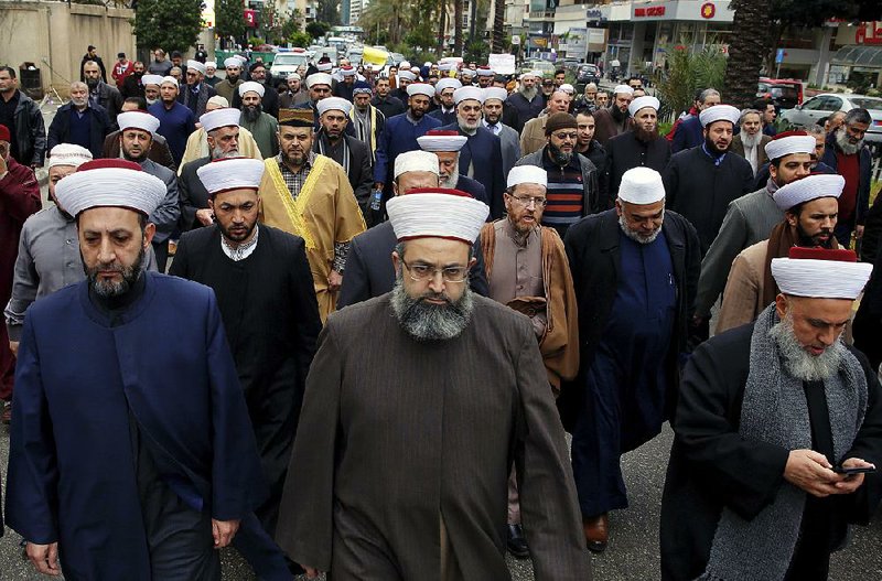 Lebanese Sunni clerics march Sunday in front of the Russian Embassy in Beirut during a protest in solidarity with residents of the eastern Ghouta suburbs of Damascus, Syria.