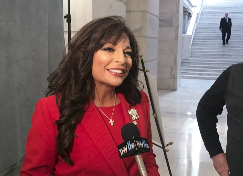 Gun range owner Jan Morgan talks to reporters on Monday at the Arkansas state Capitol in Little Rock, Ark. Morgan filed paperwork to run against Republican Gov. Asa Hutchinson in the state's May primary. (AP Photo/Andrew Demillo)