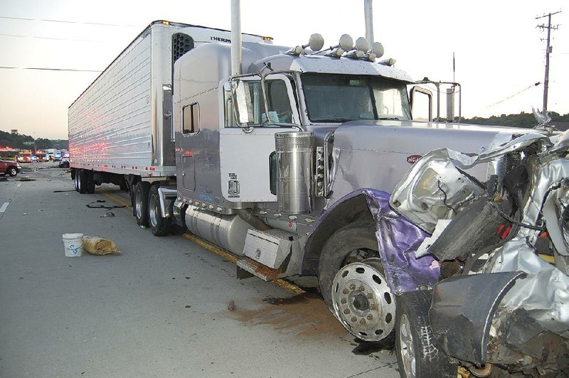 This photograph shows a tractor-trailer and a Mazda Tribute after an accident that killed six people in Chattanooga, Tenn., in June 2015. The truck had been going 80 mph before crashing into a line of vehicles backed up in a construction zone. The Trump administration is blocking regulations that deal with transportation safety problems.