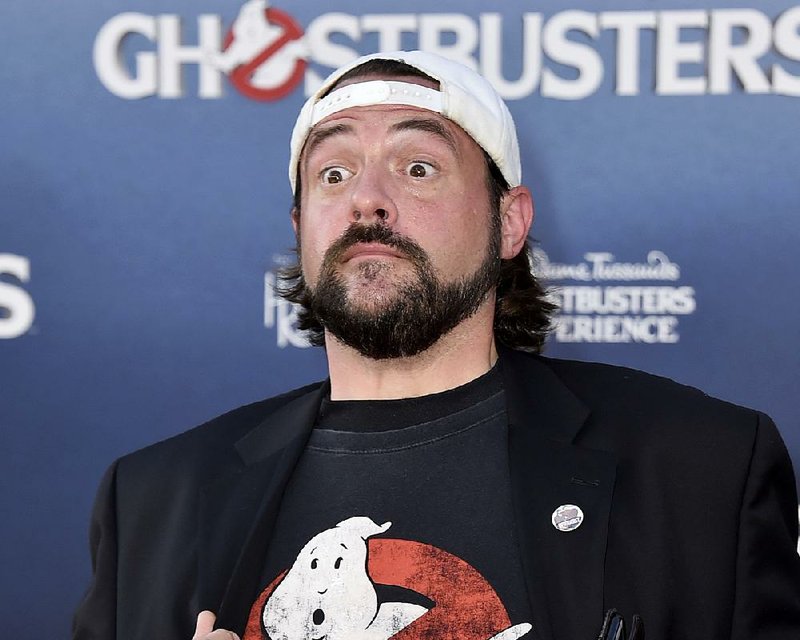 In a Saturday, July 9, 2016 file photo, Kevin Smith arrives at the Los Angeles premiere of "Ghostbusters" at the TCL Chinese Theatre. The actor-director Kevin Smith says he had a “massive” heart attack after performing at a Los Angeles comedy show Sunday night, Feb. 25, 2018. Early Monday morning, Smith said on Twitter that if he hadn’t canceled his second show Sunday and gone to the hospital, he would have died.(Photo by Jordan Strauss/Invision/AP, File)