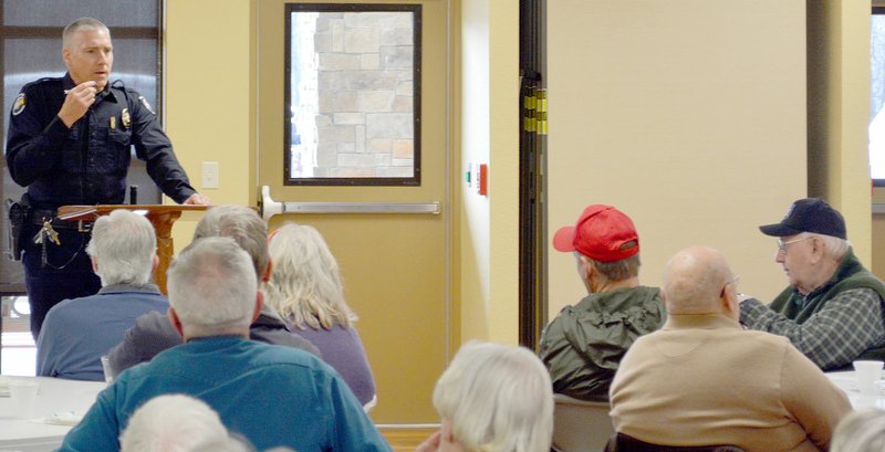 Keith Bryant/The Weekly Vista Bella Vista police chief James Graves talks with an estimated 100 Coffee With a Cop attendees at the Village Bible Church last Thursday, Feb. 22.