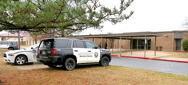 Westside Eagle Observer/RANDY MOLL Gentry police officers and Benton County Sheriff's Office deputies were outside Gentry High School Friday (Feb. 23, 2018) morning to ensure the safety of students and staff following rumors, as yet unsubstantiated, of threats of a school shooting at the high school Friday. Security was also heightened at other Gentry school campuses.