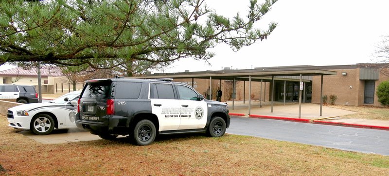 Westside Eagle Observer/RANDY MOLL Gentry police officers and Benton County Sheriff's Office deputies were outside Gentry High School Friday (Feb. 23, 2018) morning to ensure the safety of students and staff following rumors, as yet unsubstantiated, of threats of a school shooting at the high school Friday. Security was also heightened at other Gentry school campuses.