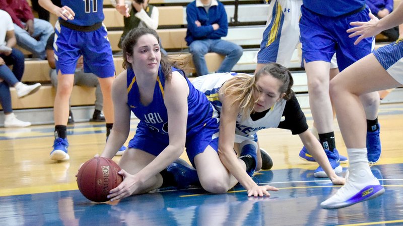 Photo courtesy of Wayland Baptist John Brown junior Baily Cameron dives on the floor for a loose ball during Saturday's game at Wayland Baptist.