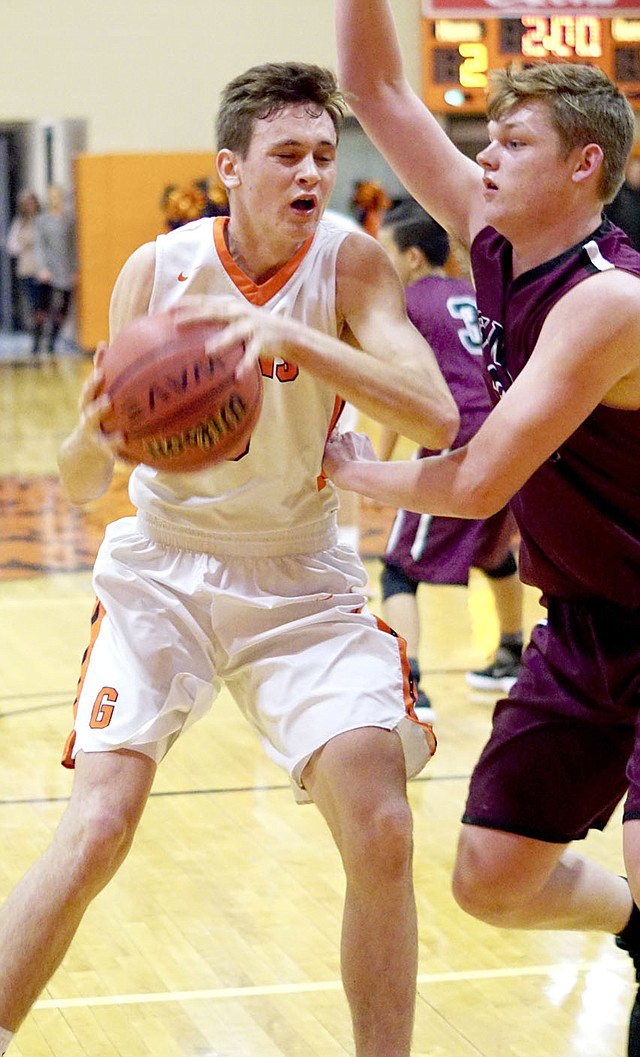 Westside Eagle Observer File Photo/RANDY MOLL Gravette' Dayten Wishon looks to shoot while guared by Gentry's Dylan Kilgore in a game earlier in the season.