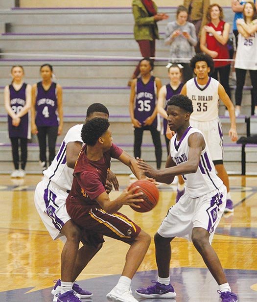 Terrance Armstard/News-Times El Dorado's Joderrio Ramey (left) and Brenden Johnson (right) double team Lake Hamilton's Mondo Watkins during a game at Wildcat Arena during the regular season. The Wildcats take on Jacksonville in the opening round of the 6A State Tournament today.