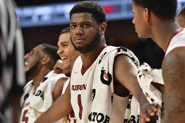 Arkansas seniors celebrate late in the second half in a win over No. 14 Auburn on Tuesday, Feb. 27, 2018 at Bud Walton Arena in Fayetteville.