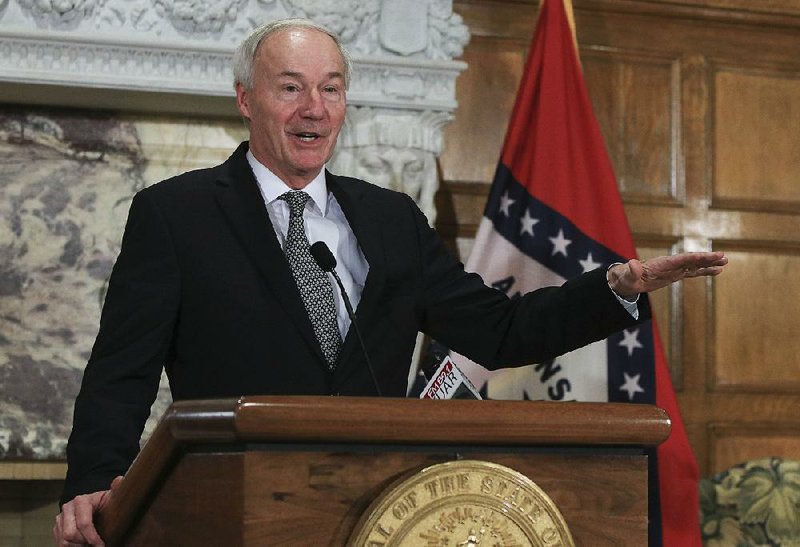 Gov. Asa Hutchinson talks during a press conference at the state Capitol in this photo. 