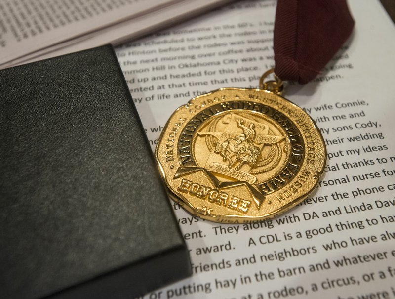 NWA Democrat-Gazette/BEN GOFF @NWABENGOFF
The medal presented to Bunky Boger honoring his induction into the National Rodeo Hall of Fame rests on a table Thursday, Dec. 28, 2017, at Boger's home in Lowell. 