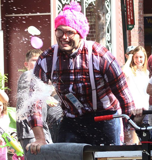 The Sentinel-Record/File photo STRANGER THINGS: A member of the Stranger Things tub team from Austin, Texas, gets pummeled with water balloons during the 12th annual Stueart Pennington Running of the Tubs on June 3, 2017.