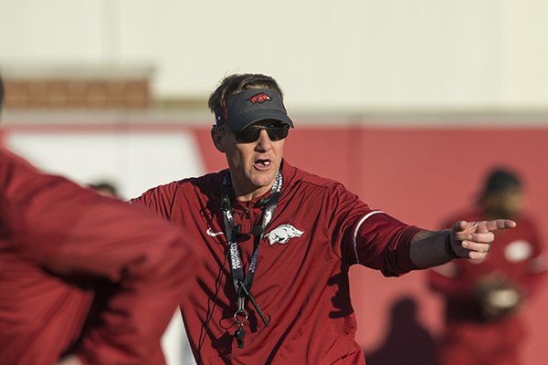 Chad Morris, Arkansas head coach, leads drills Thursday, March 1, 2018, during Arkansas spring football practice at the Fred W. Smith Football Center in Fayetteville.