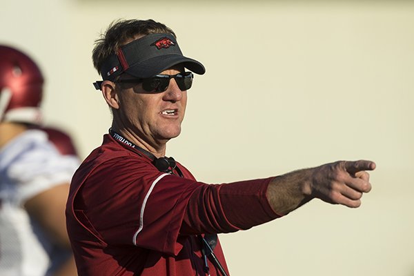 Chad Morris, Arkansas head coach, leads drills Thursday, March 1, 2018, during Arkansas spring football practice at the Fred W. Smith Football Center in Fayetteville.