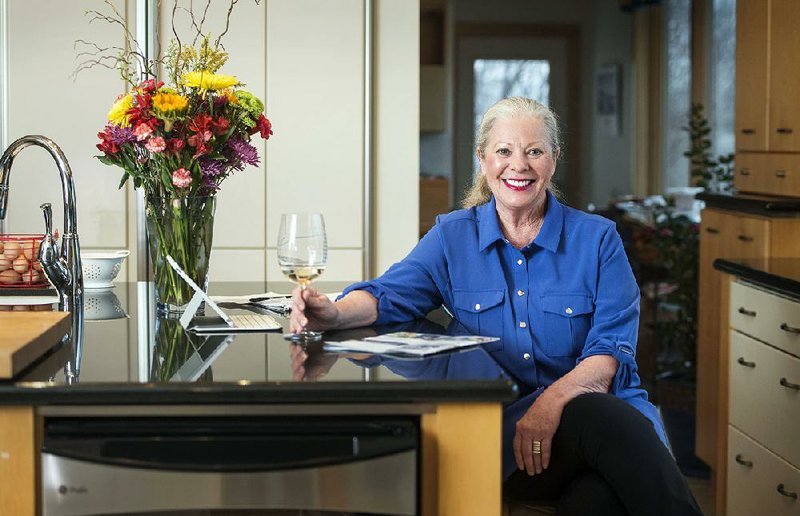 Sheila Reese, owner of Cooking Studio of Downtown Rogers, poses for a photo Tuesday, Feb. 20, 2018, in the kitchen of her home in Rogers. 