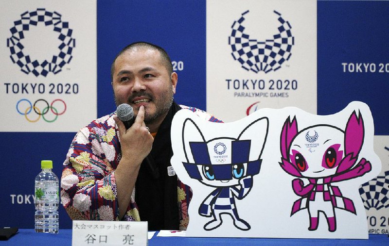 Designer Ryo Taniguchi speaks during a news conference Wednesday after the characters he designed were chosen for the Tokyo 2020 Olympics and Paralympics. 