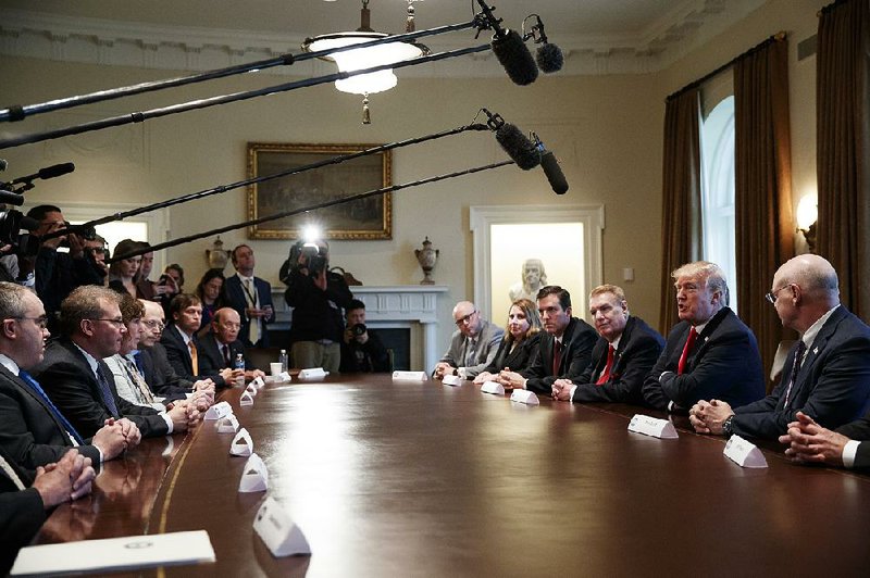 Executives of steel and aluminum companies meet with President Donald Trump on Thursday at the White House, where he announced plans to impose tariffs of 25 percent for foreign-made steel and 10 percent for aluminum.