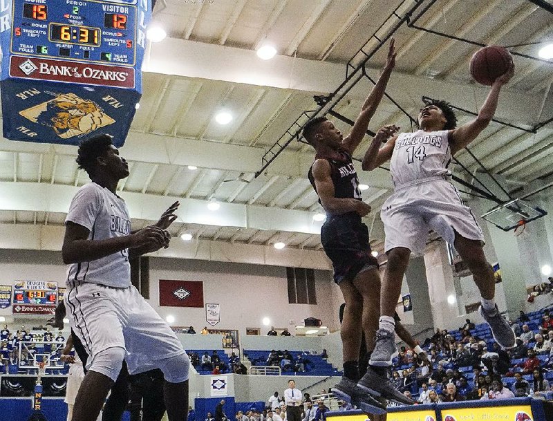 Fayetteville’s Collin Cooper (14) shoots over Springdale’s Vincent Mason during Thursday’s game at the Class 7A boys state tournament at North Little Rock High School. See more photos at arkansasonline.com/galleries. 