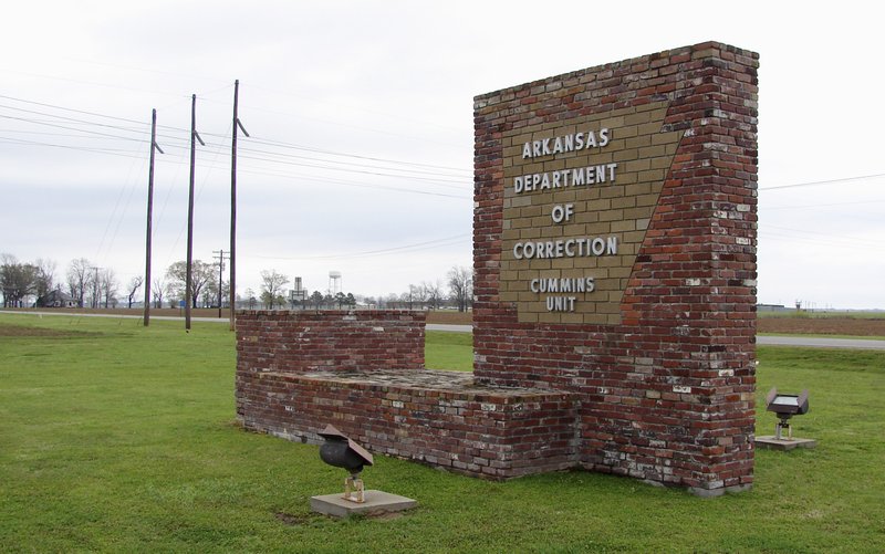 This file photo, shows a sign for the Arkansas Department of Correction's Cummins Unit prison in Varner, Ark. 