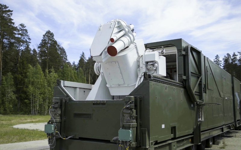 In this video grab provided by RU-RTR Russian television via AP television on Thursday, March 1, 2018, a Russian military truck with a laser weapon mounted on it is shown at an undisclosed location in Russia. President Vladimir Putin declared Thursday that Russia has developed a range of new nuclear weapons, claiming they can't be intercepted by enemy. (RU-RTR Russian Television via AP)