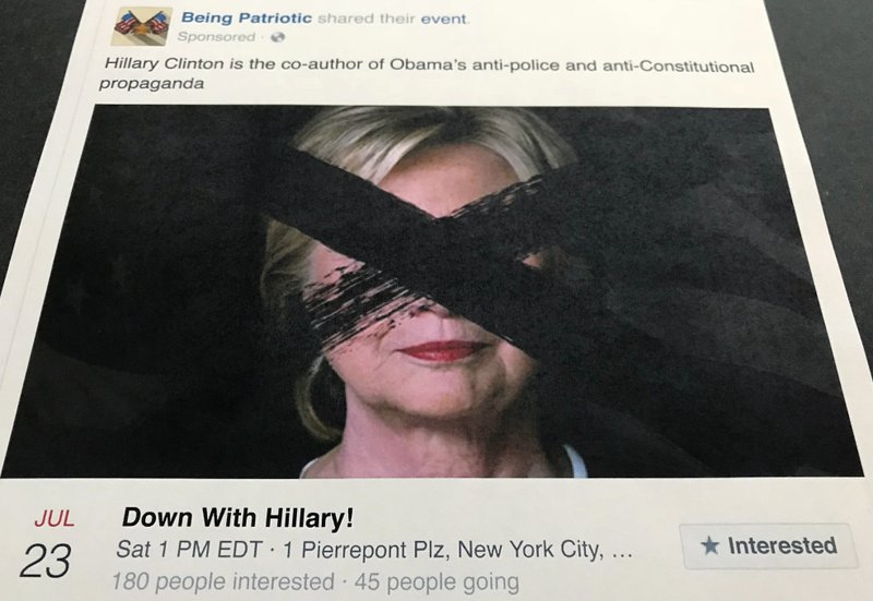 A Facebook posting released by the House Intelligence Committee, for a group called "Being Patriotic" is photographed in Washington, Friday, Feb. 16, 2018. For candidates running in the 2018 elections, it's a race against Russia _ or other actors, perhaps _ as they try to ensure that they aren't thrown off message by misinformation campaigns like the one special counsel Robert Mueller laid out in his surprise indictment in the Russia investigation last week. (AP Photo/Jon Elswick)