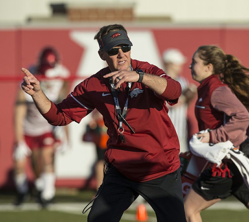 NWA Democrat-Gazette/Ben Goff DRILL TEAM: New Arkansas Razorbacks head football coach Chad Morris leads drills Thursday during his first spring football practice with the team at the Fred W. Smith Football Center in Fayetteville.