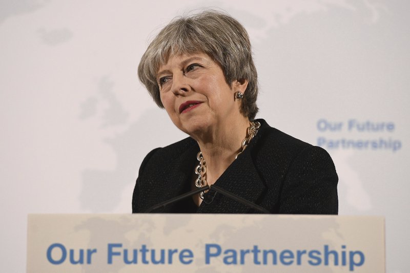 Britain's Prime Minister Theresa May listens to a question at Mansion House, in London, Friday, March 2, 2018. May is promising to tell an impatient European Union on Friday what Britain is prepared to give and what it wants to take in a post-Brexit trade deal with the bloc.(Leon Neal/Pool Photo via AP)