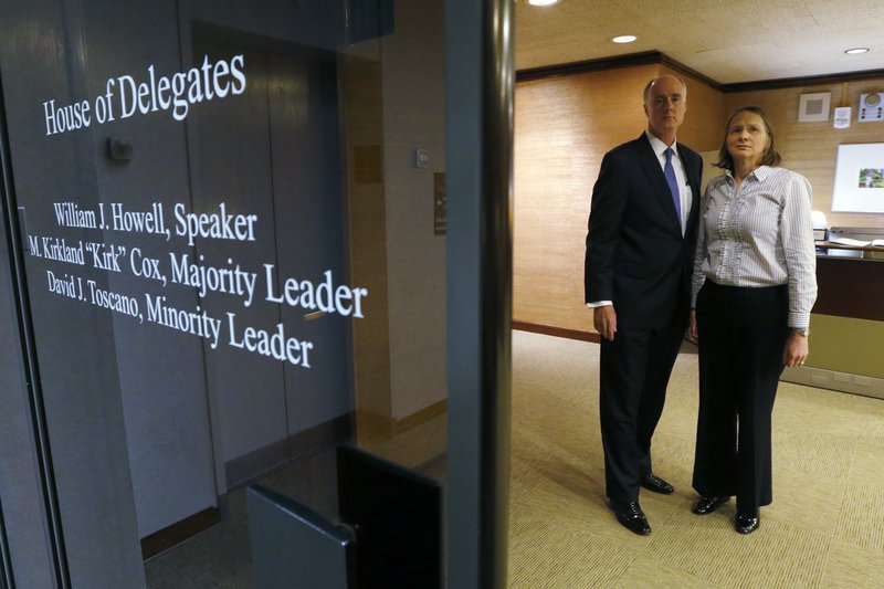  In this Jan. 27, 2017 file photo, John Graham, left, and his wife Sue Graham, pose in the hallway leading to the Speaker's office in the General Assembly Building in Richmond, Va. The parents of slain University of Virginia student Hannah Graham, were visiting the Capitol and earlier had met with legislators, including House Speaker William J. Howell, R-Stafford. They have been lobbying Virginia lawmakers to add trespassing and several other misdemeanors to the list of crimes that trigger mandatory DNA collection. It’s part of a nationwide movement to expand DNA databanks by including misdemeanors ranging from shoplifting to trespassing to destruction of property. (Bob Brown/Richmond Times-Dispatch via AP)