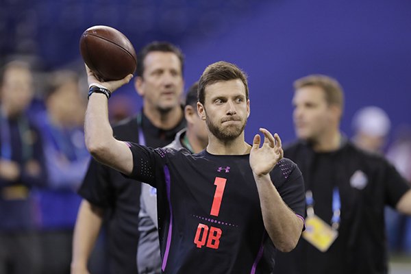 Arkansas quarterback Austin Allen throws during a drill at the NFL football scouting combine, Saturday, March 3, 2018, in Indianapolis. (AP Photo/Darron Cummings)

