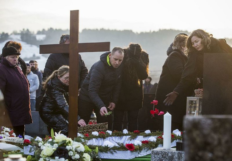 Mourners attend the funeral Saturday for investigative journalist Jan Kuciak in Stiavnik, Slovakia.