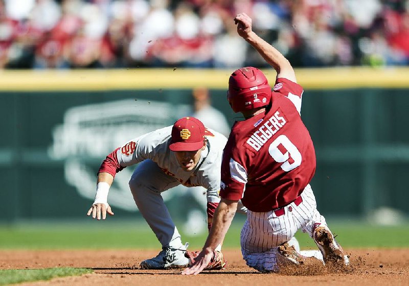 Arkansas infielder Jax Biggers (9) slides into second during the Razorbacks’ 3-1 loss to Southern California on Saturday. Biggers went 2 for 5 as Arkansas fell to 8-3 on the season. 