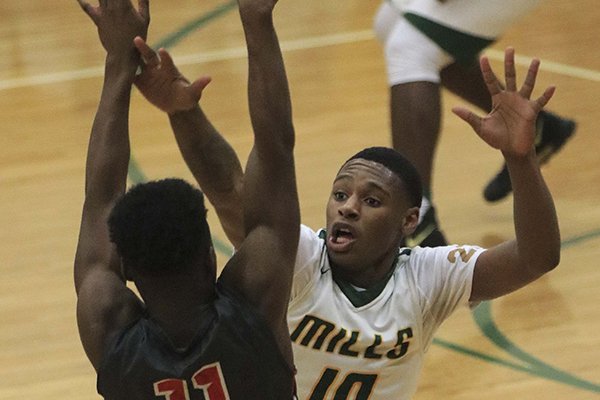 Mills' Madison Peaster (10) defends White Hall's Tylin Walker (11) during a game Tuesday, Jan. 23, 2018, in Little Rock. 