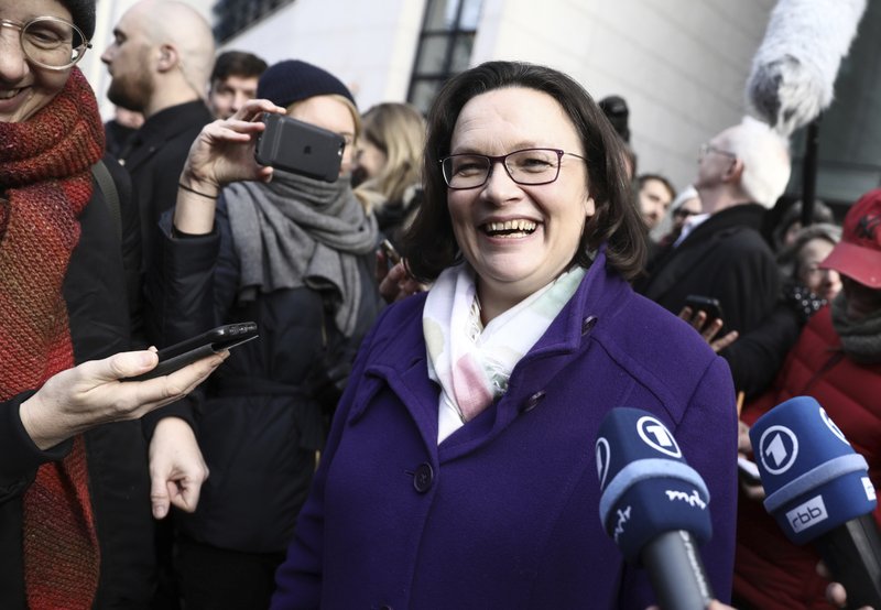 Social Democratic party's parliamentary leader and designated party chairwoman Andrea Nahles smiles when leaving the party's headquarters in Berlin Sunday, March 4,.2018 after the party members voted for a coalition agreement with the Christian Democratic party. (Kay Nietfeld/dpa via AP)