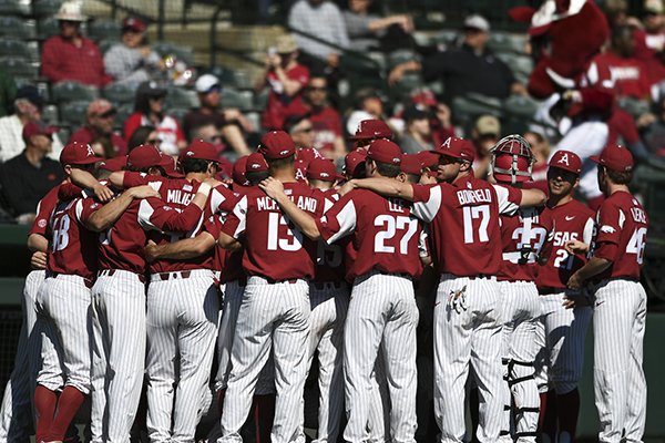 Arkansas baseball players prepare to play during a baseball game, Saturday, March 3, 2018 at Baum Stadium in Fayetteville.