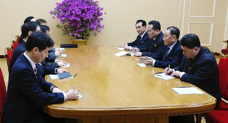 In this photo provided by South Korea Presidential Blue House via Yonhap News Agency, Kim Yong Chol, vice chairman of North Korea’s ruling Workers’ Party Central Committee (second from right), talks with a South Korean delegation in Pyongyang, North Korea, on Monday.