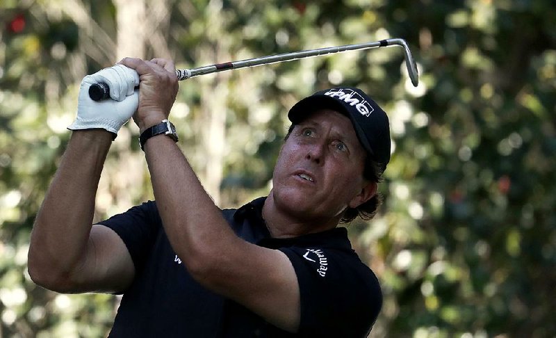 Phil Mickelson watches his shot on the 17th hole during the third round of the Mexico Championship on Saturday at the Chapultepec Golf Club in Mexico City. Mickelson won for the fi rst time since 2013 when he beat Justin Thomas in a playoff Sunday.