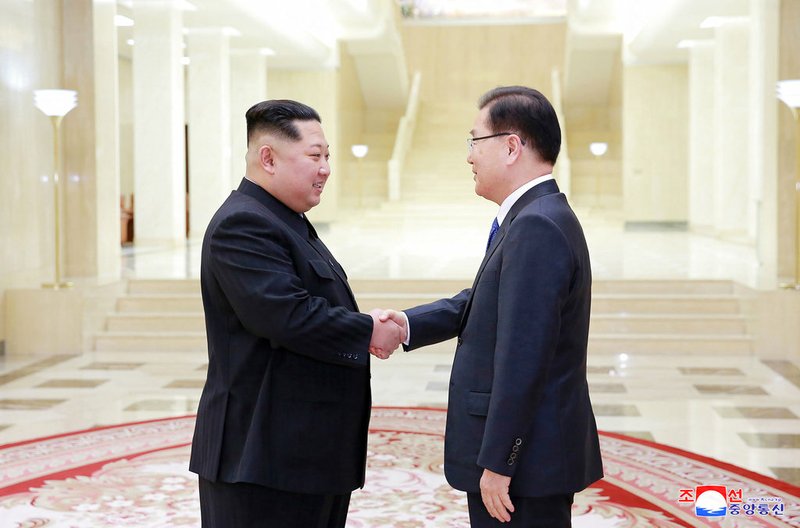 In this Monday, March 5, 2018 photo, provided by the North Korean government on March 6, North Korean leader Kim Jong Un, left, shakes hands with South Korean National Security Director Chung Eui-yong in Pyongyang, North Korea. Independent journalists were not given access to cover the event depicted in this image distributed by the North Korean government. The content of this image is as provided and cannot be independently verified. Korean language watermark on image as provided by source reads: "KCNA" which is the abbreviation for Korean Central News Agency.