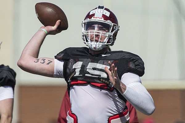Arkansas quarterback Cole Kelley throws a pass during practice Saturday, March 3, 2018, in Fayetteville. 