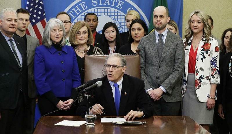 Washington Gov. Jay Inslee speaks Monday in Olympia before he signs a bipartisan state measure to prohibit Internet providers from blocking content or interfering with online traffic. 

