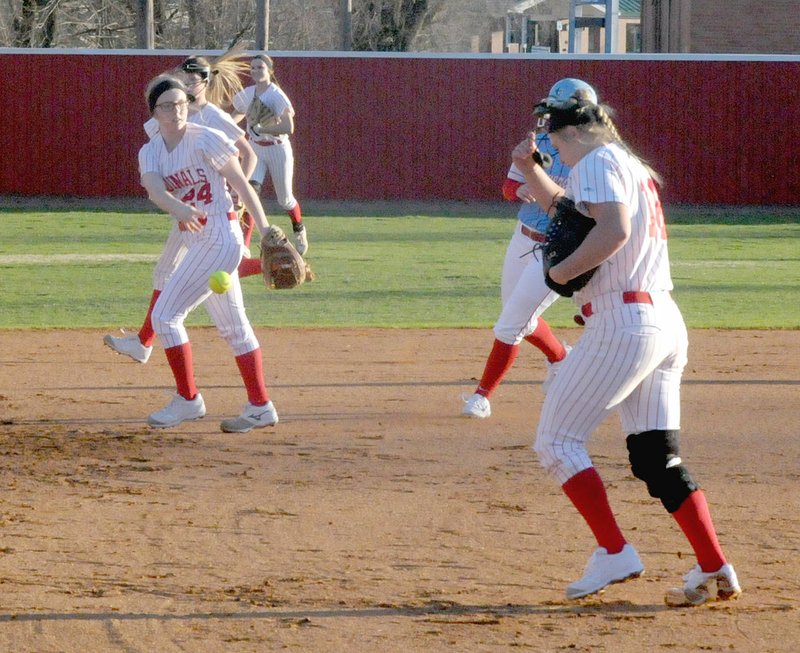 MARK HUMPHREY ENTERPRISE-LEADER Farmington sophomore Paige Anderson leaves the ball on the field after catching a line drive to record the third out and stranding a base-runner in the second inning of the Lady Cardinals' 3-1 season-opening win over Fort Smith Southside on Feb. 26.