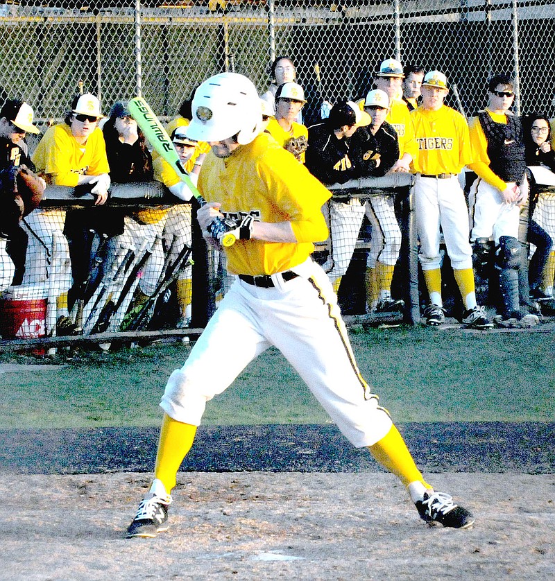 MARK HUMPHREY ENTERPRISE-LEADER Prairie Grove senior James Birmingham is hit by a pitch during the Tigers' 13-2 loss to Siloam Springs on opening day, Monday, Feb. 26.