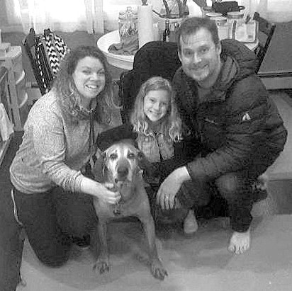 SUBMITTED Red, a dog from the Decatur Animal Shelter, is pictured with his new family in Illinois, thanks to the work of animal rescue organizations like Tailwaggers.