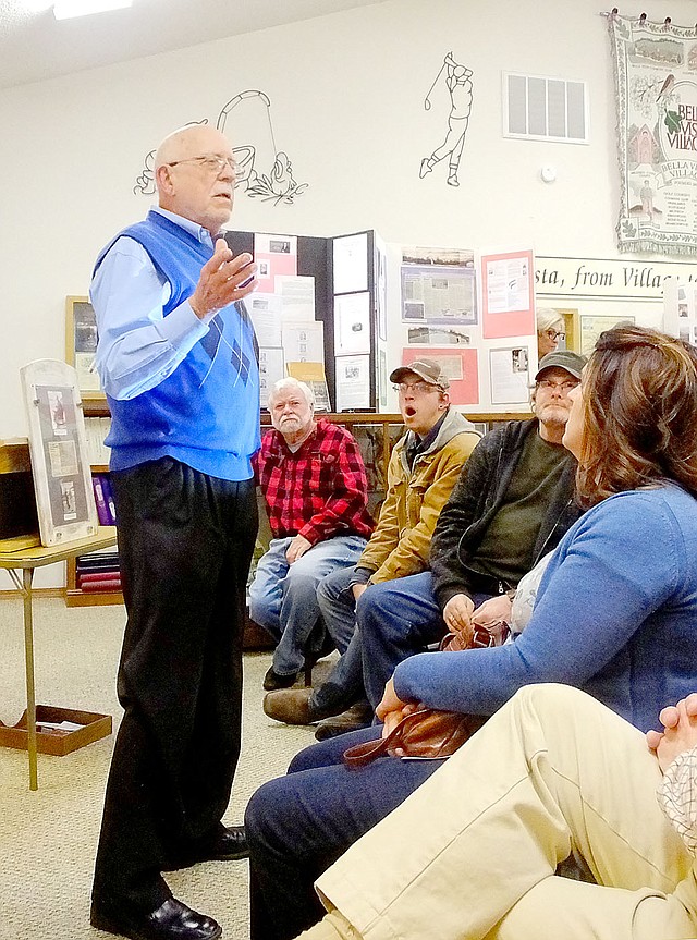 Lynn Atkins/The Weekly Vista Retired college administrator Frank Terry tells a crowd at the Bella Vista Historical Museum about an incident that involved his family in 1857, the Mountain Meadow Massacre.